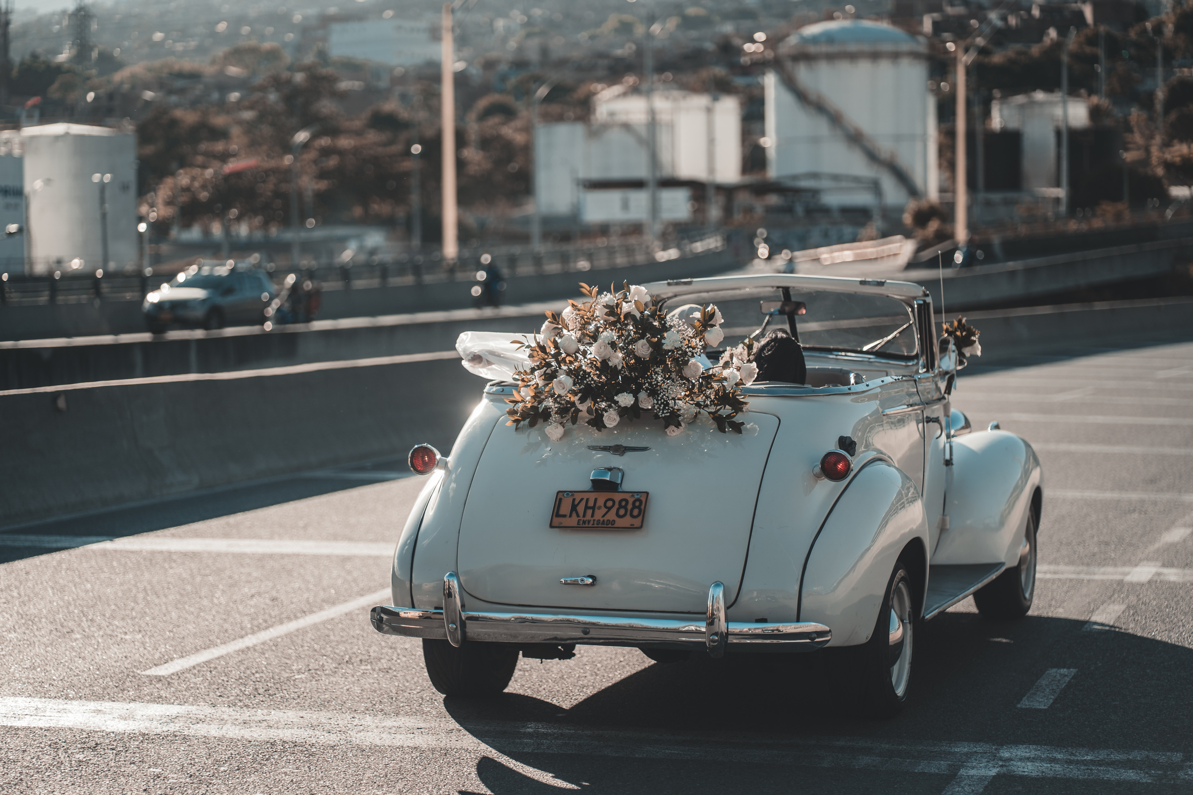 Retro wedding cabriolet driving on road