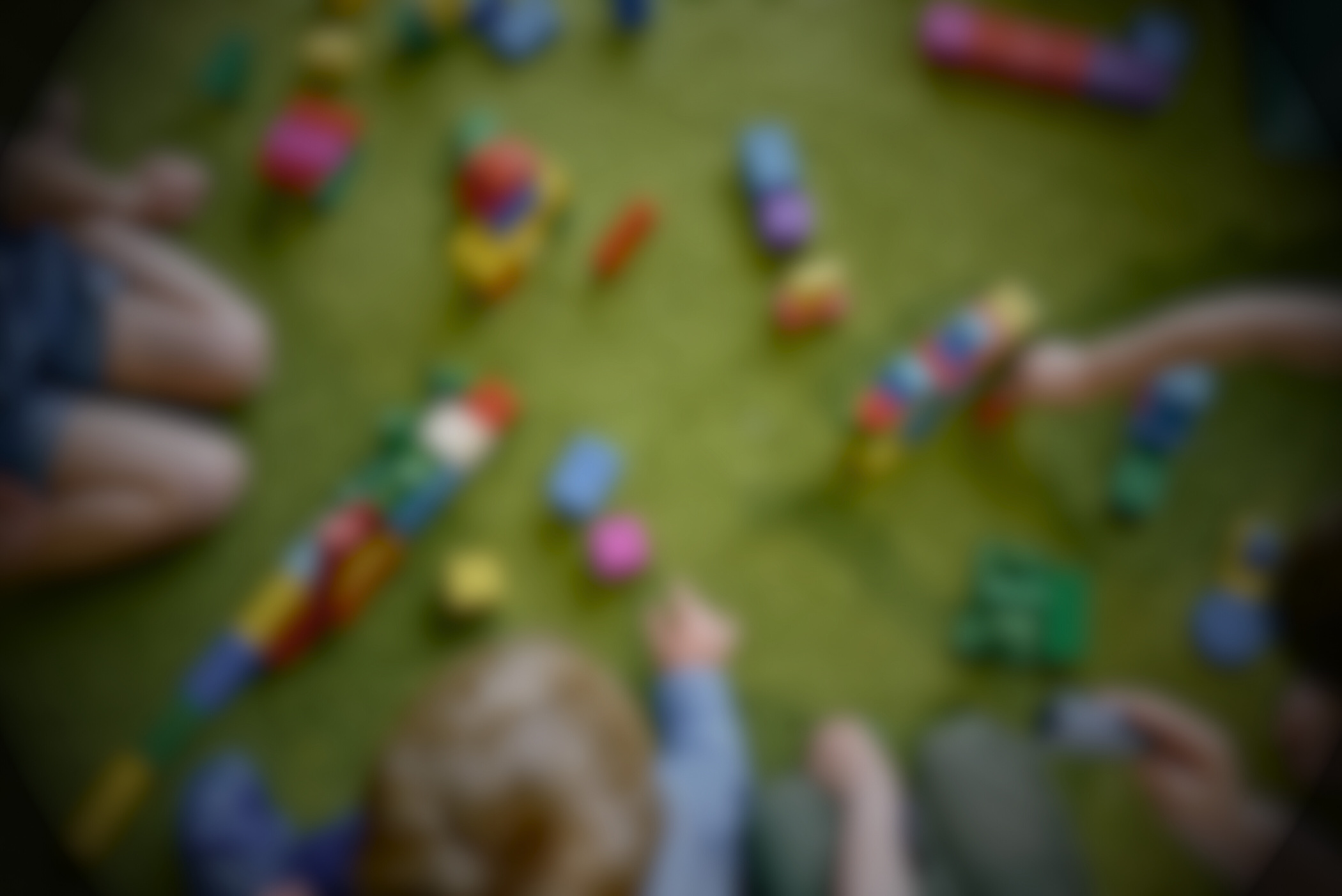 Children Playing with Colorful Wooden Blocks